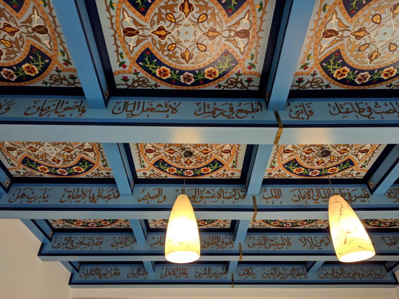 Beautiful hand-painted wood panels on the ceiling
